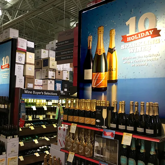 Holiday sparkling wine campaign in a retail aisle