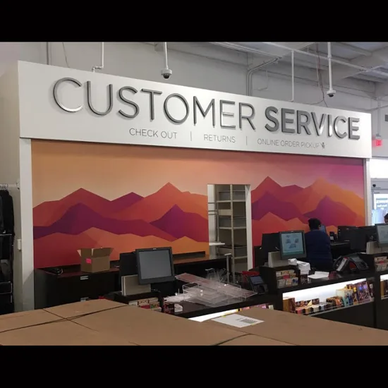 Customer service department signage and mountain mural at Kohl's